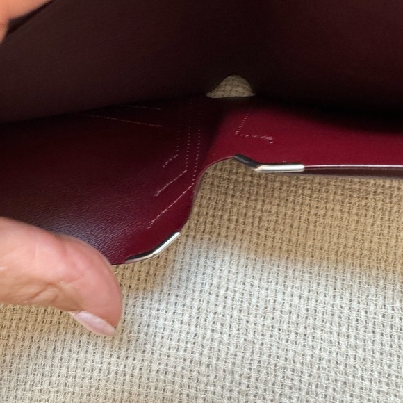 Cartier wallet. NWOT Brown exterior, burgundy interior. Shopping bag included. - Picture 8 of 10